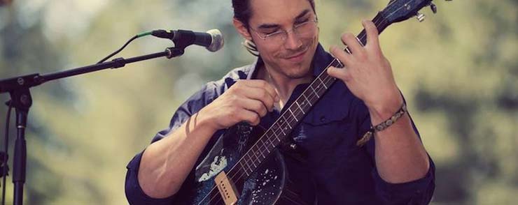 Sean Frenette with his 3-string guitar