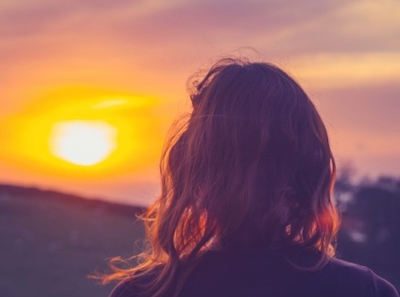 woman watching sunset